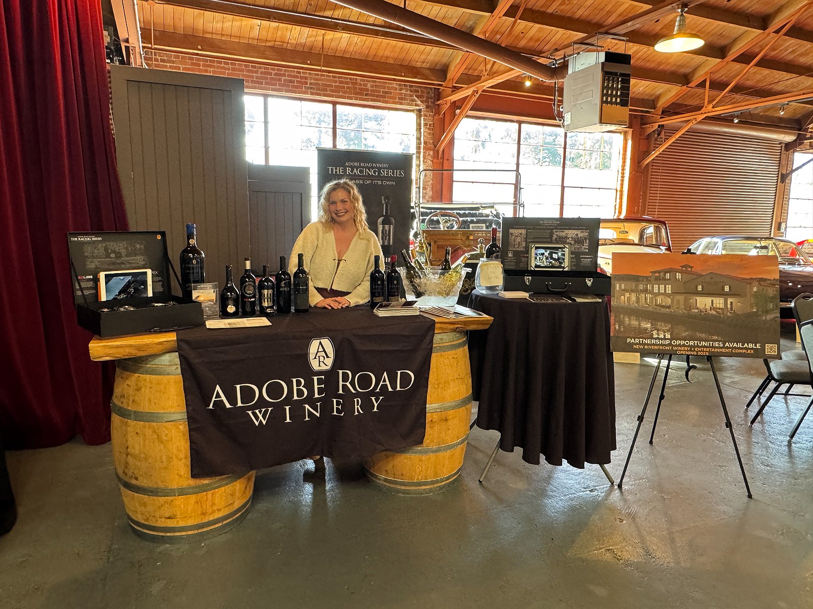 A winery pouring at a barrel-top tasting table